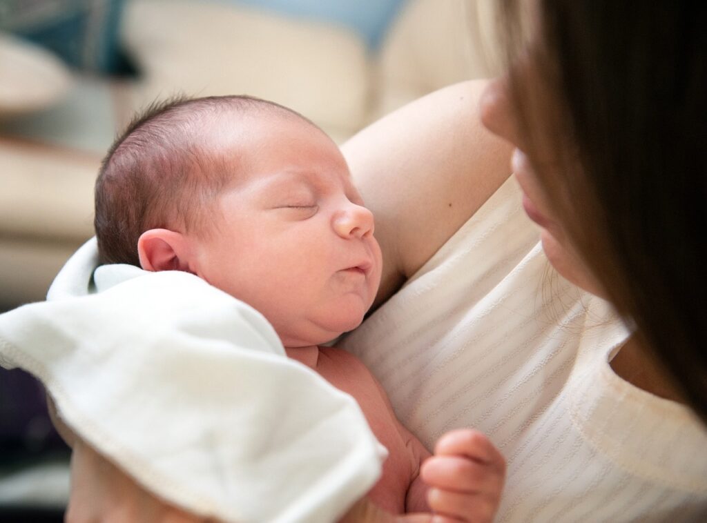 Mother holding her adopted baby